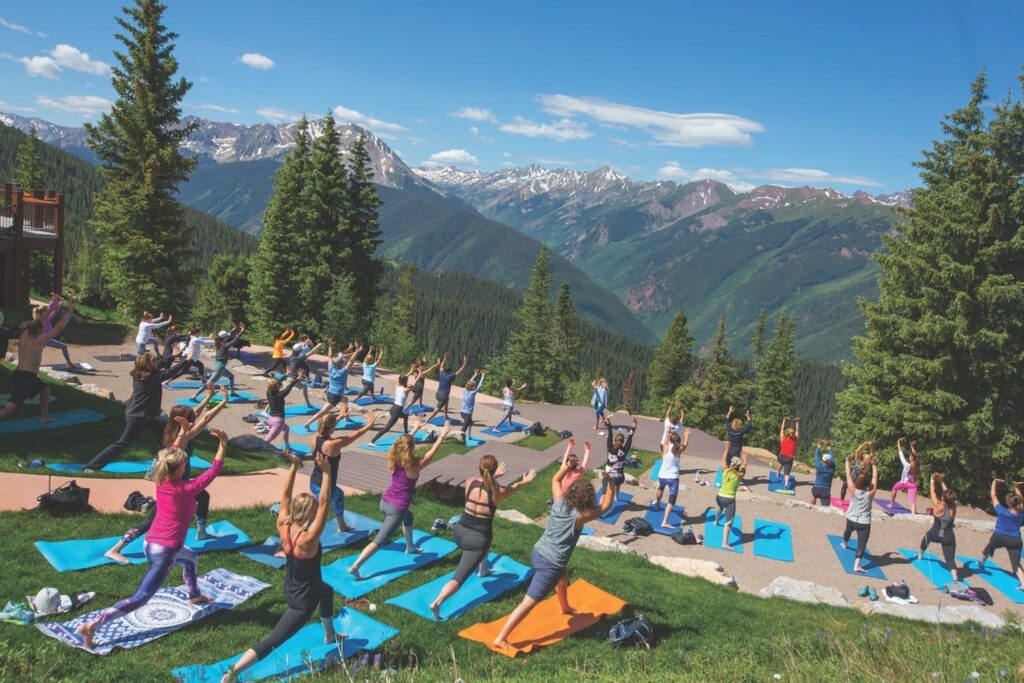 Outdoor yoga session at sunrise in Aspen