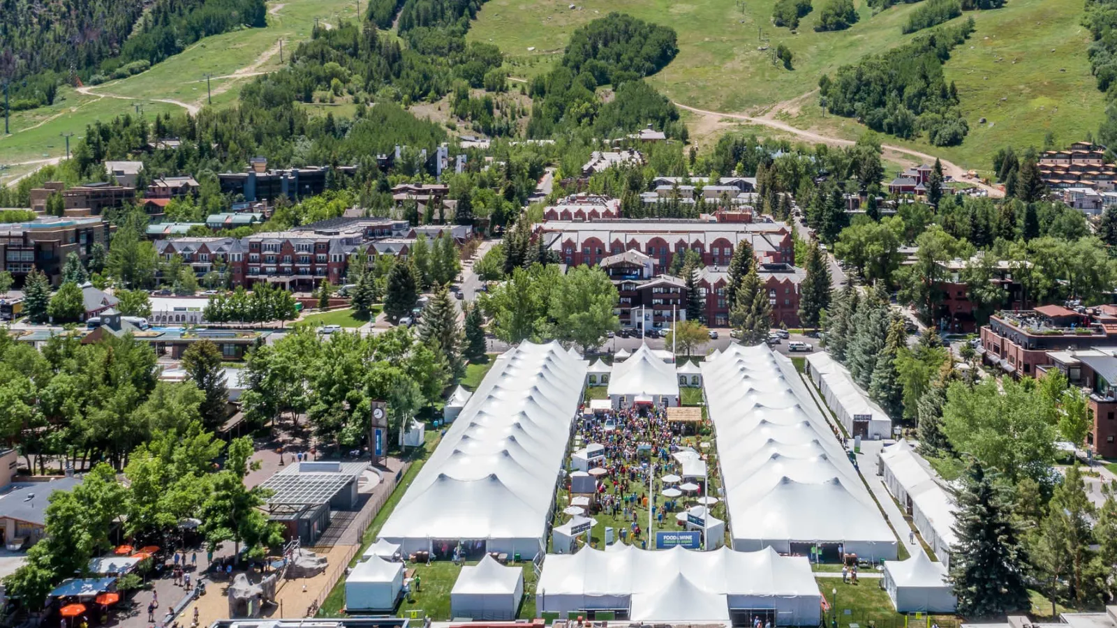 Drone shot over Wagner Park in Aspen, Colorado. Food & Wine annual event 2025. Summer.